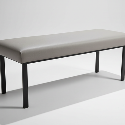 Side view of grey padded bench showing profile and legs