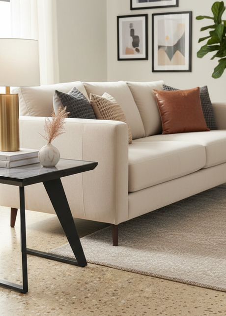 Grey gloss side lamp table styled next to sofa in contemporary living room
