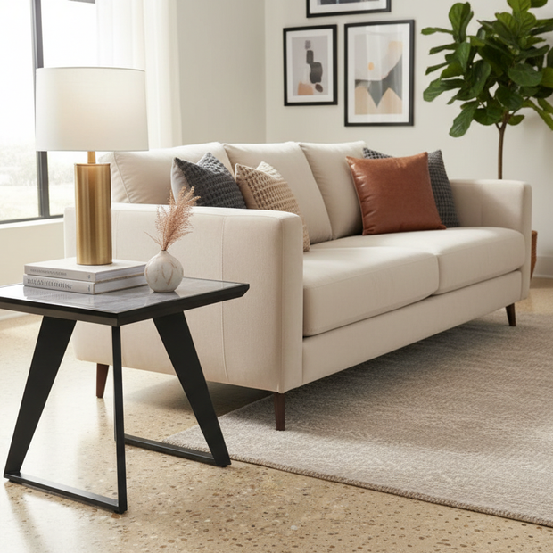 Grey gloss side lamp table styled next to sofa in contemporary living room