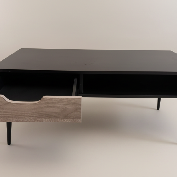 Black coffee table with open drawer showing storage space